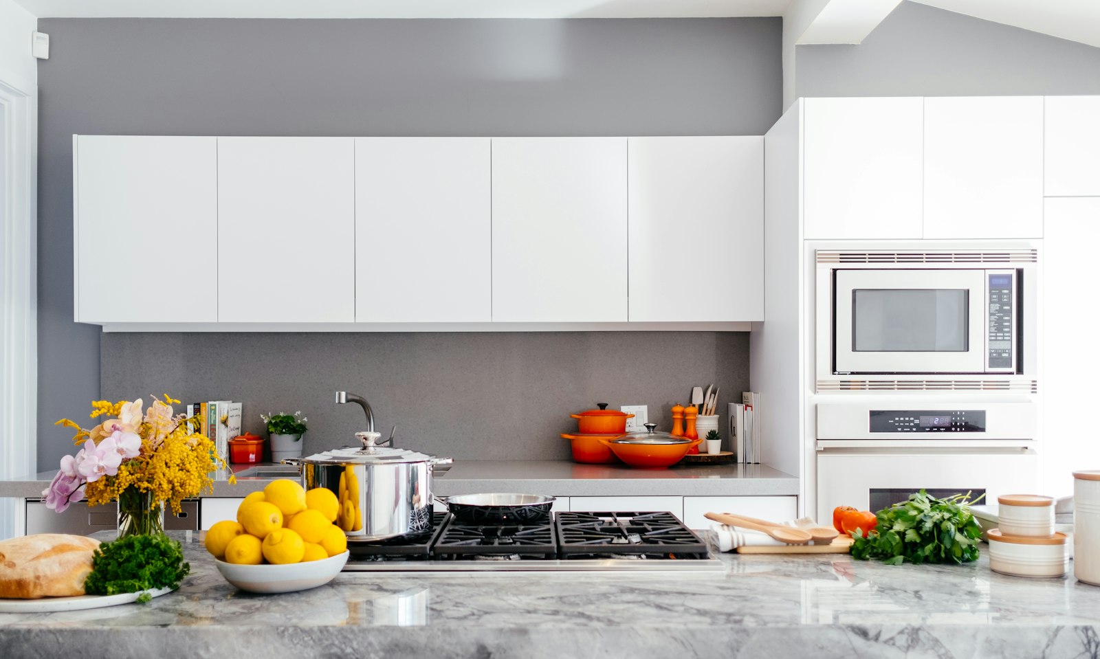 Warm kitchen with marble island in natural light